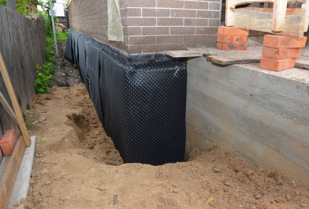 Happy homeowners after waterproofing job in Towanda
